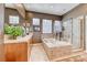 A full view of a bathroom with a stand up glass shower, large tub, and double vanity at 4 Annadale Ct, Henderson, NV 89052