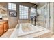 A close up view of a bathroom with a stand up shower and soaking tub at 4 Annadale Ct, Henderson, NV 89052