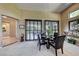 Elegant dining area with a modern table, comfortable seating, stylish decor, and large windows for natural light at 4 Annadale Ct, Henderson, NV 89052