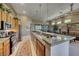 Spacious kitchen with granite countertops, modern appliances, and seamless flow into the living area at 4 Annadale Ct, Henderson, NV 89052