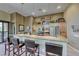 The kitchen features granite countertops, stainless steel appliances, and barstool seating at 4 Annadale Ct, Henderson, NV 89052