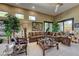 Spacious living room featuring comfortable seating, unique decor, large windows, and ample natural light at 4 Annadale Ct, Henderson, NV 89052