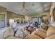 Open-concept living space with bar seating, comfortable sofa, stylish lamps, and seamless flow to the kitchen at 4 Annadale Ct, Henderson, NV 89052