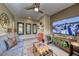 Comfortable living room with modern ceiling fan and entertainment center, perfect for relaxation and gatherings at 4 Annadale Ct, Henderson, NV 89052
