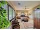 Cozy main bedroom features a large window, accent furniture, and elegant décor at 4 Annadale Ct, Henderson, NV 89052