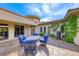 Inviting outdoor patio with stylish seating, flagstone flooring, and lush landscaping create a serene retreat at 4 Annadale Ct, Henderson, NV 89052