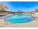 Sparkling community pool with ample lounge chairs and pergola-covered seating areas at 4 Annadale Ct, Henderson, NV 89052