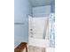 Bathroom featuring blue walls, white bath tub with shower and faucet at 4350 Westbury Square St # 3, North Las Vegas, NV 89032