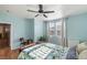 Bedroom featuring wooden floors, a ceiling fan, and bright windows at 4350 Westbury Square St # 3, North Las Vegas, NV 89032