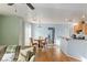 Open dining area featuring hardwood floors, a chandelier, and seamless flow to the kitchen at 4350 Westbury Square St # 3, North Las Vegas, NV 89032