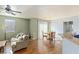 Inviting living room and dining area featuring hardwood floors, a ceiling fan, and plenty of natural light at 4350 Westbury Square St # 3, North Las Vegas, NV 89032
