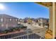 Balcony view of a charming street showcasing well-maintained homes and landscaping at 4350 Westbury Square St # 3, North Las Vegas, NV 89032