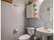 Charming half bathroom with a pedestal sink, modern fixtures, and decorative accents for a welcoming guest experience at 4610 Lime Straight Dr, Las Vegas, NV 89115