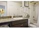 Bathroom featuring a single vanity, decorative mirror, and a shower-tub combination at 4610 Lime Straight Dr, Las Vegas, NV 89115