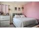 Cozy bedroom featuring a neutral color scheme, minimalist decor, and soft lighting at 4610 Lime Straight Dr, Las Vegas, NV 89115
