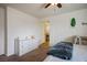 Cozy bedroom showcasing neutral walls, carpet floors, and an adjacent bathroom at 4610 Lime Straight Dr, Las Vegas, NV 89115