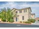Inviting two-story home showcasing a neutral exterior with complementing dark shutters, creating a cozy curb appeal at 4610 Lime Straight Dr, Las Vegas, NV 89115