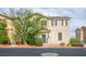 Charming two-story home showcasing a well-maintained exterior with neutral tones and complementing dark shutters at 4610 Lime Straight Dr, Las Vegas, NV 89115