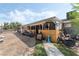 Backyard featuring a covered patio and some scattered items, including blue heater, paintings, and storage bins at 4870 E Colorado Ave, Las Vegas, NV 89104