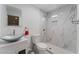 Stylish bathroom featuring a vessel sink, tiled shower with a built-in niche, and modern fixtures at 4870 E Colorado Ave, Las Vegas, NV 89104