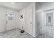 Bright entryway showcasing marble floors, a decorative front door, and neutral walls at 4870 E Colorado Ave, Las Vegas, NV 89104