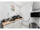 Functional kitchenette with a sink, countertop appliances, and bright natural light at 4870 E Colorado Ave, Las Vegas, NV 89104