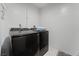 Laundry room featuring a side-by-side washer and dryer and clean white walls at 4870 E Colorado Ave, Las Vegas, NV 89104