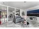 Open-concept living room with sleek marble flooring, comfortable seating, and an adjacent modern kitchen at 4870 E Colorado Ave, Las Vegas, NV 89104