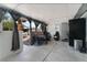 Enclosed patio featuring a table, chairs, and office chair, offering a relaxed outdoor space at 4870 E Colorado Ave, Las Vegas, NV 89104