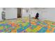 Playful recreation room with colorful alphabet floor mats and ample space for activities at 4870 E Colorado Ave, Las Vegas, NV 89104