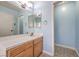 Bathroom vanity with tile countertop and light blue walls at 5068 Jeffreys St # 202, Las Vegas, NV 89119