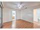 Bright bedroom featuring light walls, wood floors, and a ceiling fan at 5068 Jeffreys St # 202, Las Vegas, NV 89119