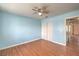 Bedroom featuring wood floors, closet, and a ceiling fan at 5068 Jeffreys St # 202, Las Vegas, NV 89119