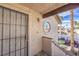 Entrance of a home with a security door and unique round window at 5068 Jeffreys St # 202, Las Vegas, NV 89119