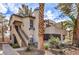 Exterior of a two-story home with desert landscaping and mature trees at 5068 Jeffreys St # 202, Las Vegas, NV 89119