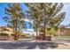 Charming Santa Fe Haciendas gated community entrance with mature trees and landscaped surroundings at 5068 Jeffreys St # 202, Las Vegas, NV 89119