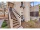 Exterior of a multi-level home with a staircase leading to the entrance at 5068 Jeffreys St # 202, Las Vegas, NV 89119