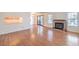 Open living room with hardwood floors, fireplace, and a view to kitchen at 5068 Jeffreys St # 202, Las Vegas, NV 89119