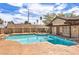 Community pool with clear blue water and lounge chairs at 5068 Jeffreys St # 202, Las Vegas, NV 89119