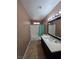 This bathroom has a sink, shower and tile floors at 5594 Ricochet Ave, Las Vegas, NV 89110