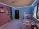 Bright ' bedroom with a closet, a white bed, and LED lighting around the ceiling at 5594 Ricochet Ave, Las Vegas, NV 89110