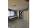 This bedroom features a closet, tile floors, and neutral-colored walls at 5594 Ricochet Ave, Las Vegas, NV 89110