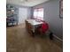 Dining area featuring tile flooring, neutral paint and a dining table with seating for eight at 5594 Ricochet Ave, Las Vegas, NV 89110