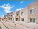 Modern townhouse with neutral colors, stone accents, and manicured landscaping at 600 N Carriage Hill Dr # 1008, Las Vegas, NV 89138