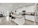Modern kitchen with a large island, bar stools, and stainless steel appliances at 600 N Carriage Hill Dr # 1008, Las Vegas, NV 89138