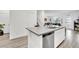 Modern kitchen with gray countertops, stainless steel appliances, and white cabinets at 600 N Carriage Hill Dr # 1008, Las Vegas, NV 89138