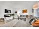 Comfortable living room featuring a large sectional sofa, stylish decor, and bright natural light at 600 N Carriage Hill Dr # 1008, Las Vegas, NV 89138