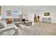 Cozy living room with a large sectional sofa, rug, and a modern aesthetic at 600 N Carriage Hill Dr # 1008, Las Vegas, NV 89138