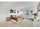 Inviting main bedroom with neutral tones, carpet floors and a picturesque window view at 600 N Carriage Hill Dr # 1008, Las Vegas, NV 89138