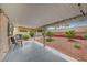 Covered patio, and landscaped yard for outdoor enjoyment and entertainment at 6131 Cozy Creek St, North Las Vegas, NV 89031
